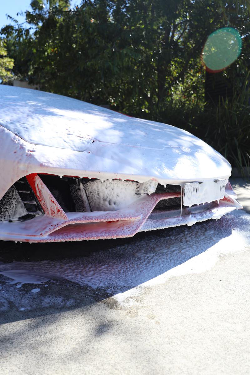 Snow foam covering the bonnet and front of a car